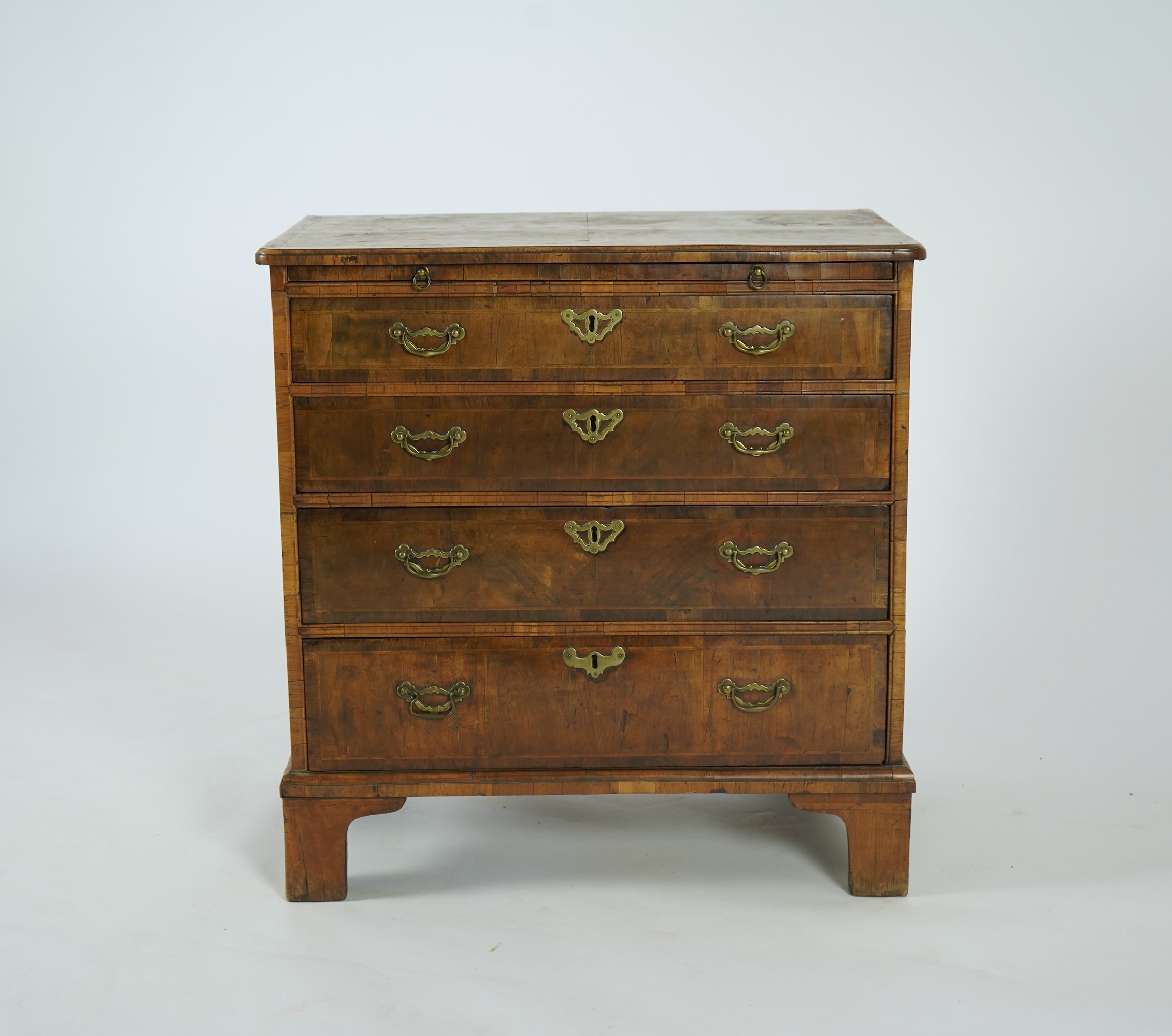 A small George I feather banded walnut chest